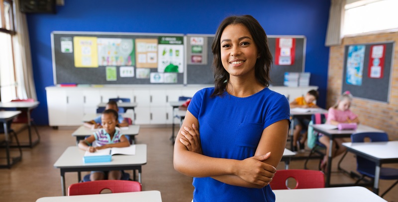 Portrait of african american female teacher with arms crossed sm